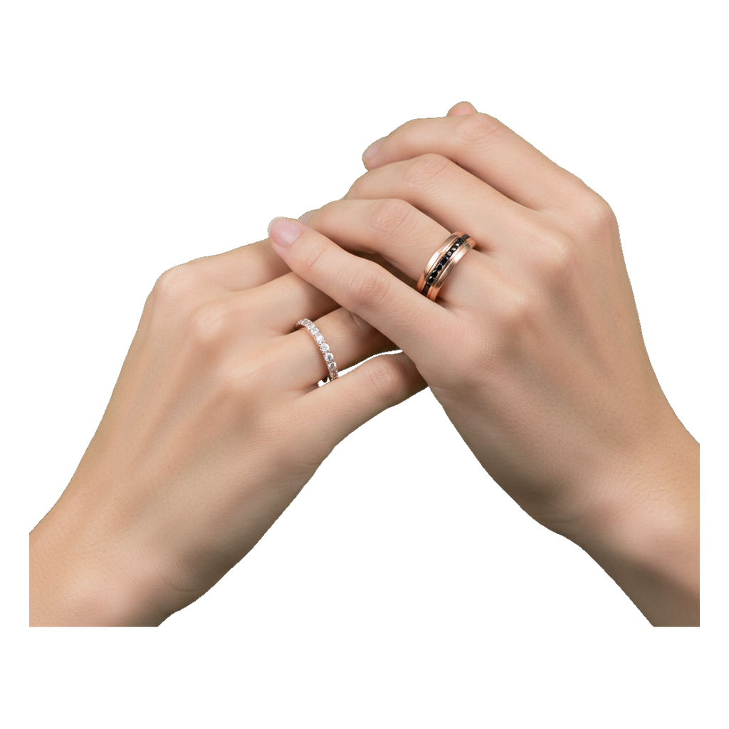 Rose gold couple rings on hands